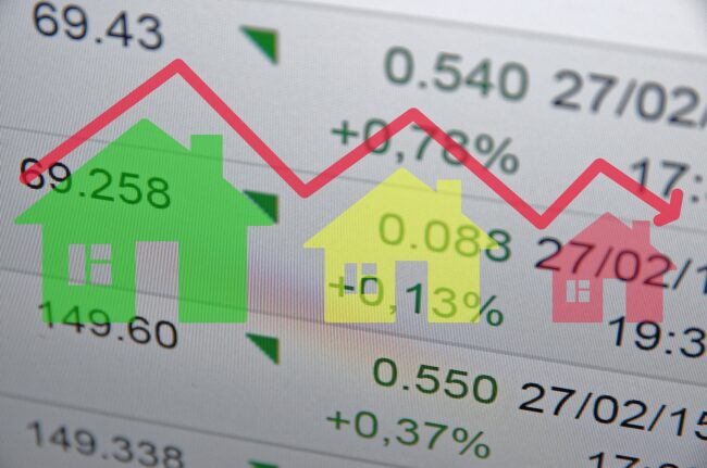 Down trend housing market concept. Financial data on the background.
