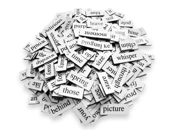 Large pile of various words placed over white background.