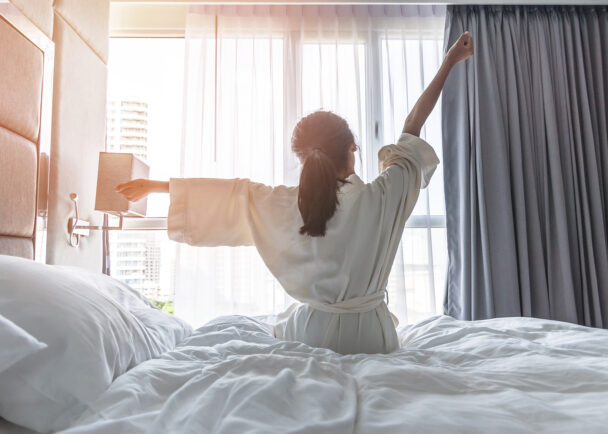  woman waking up early in the morning getting ready to start her busy real estate day. 